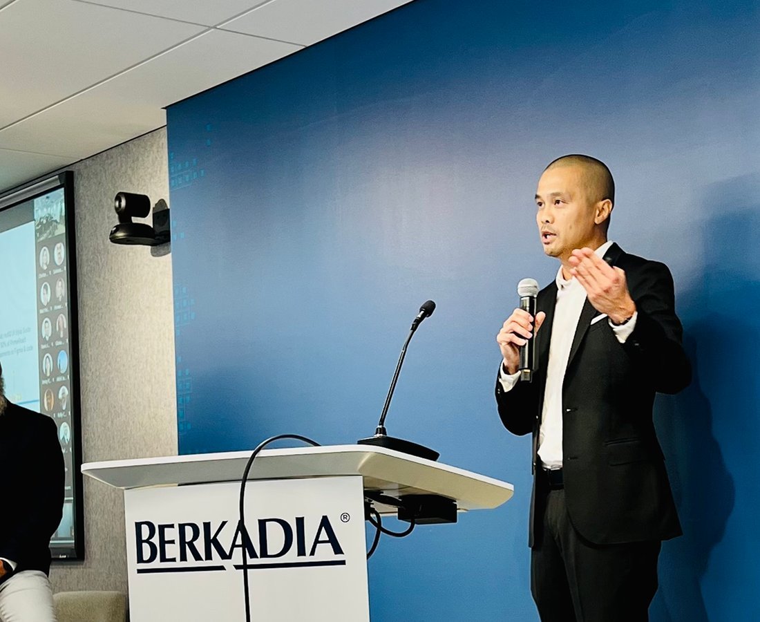 Elias Sipin presenting at the Berkadia podium